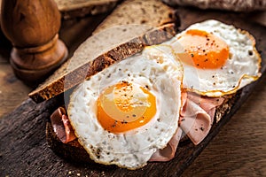 Fried eggs and ham for breakfast photo