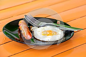 Fried eggs with hot dog, breakfast for children.