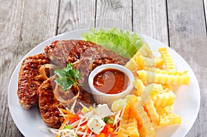 Fried Escalope with Fries on White Plate