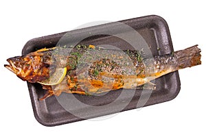 Fried European seabass (sea bass) on a dark tray