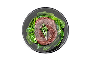 Fried Fillet Mignon tenderloin meat beef steak in a pan with salad. Isolated, white background. Top view.