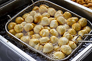 Fried Fish Ball In Boiled Oil On A Pan.