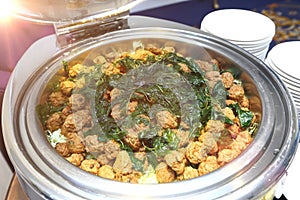 Fried Fish Cakes Thai Food Crispy Basil topping in round stainless boiled pot for catering and side dishes