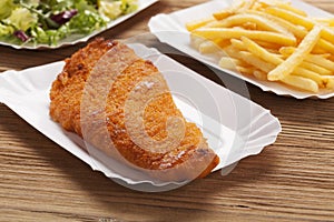 Fried fish and chips on a paper tray