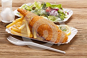 Fried fish and chips on a paper tray