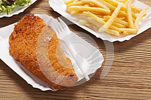 Fried fish and chips on a paper tray