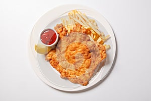 Fried fish and chips on the white plate
