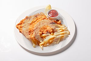 Fried fish and chips on the white plate