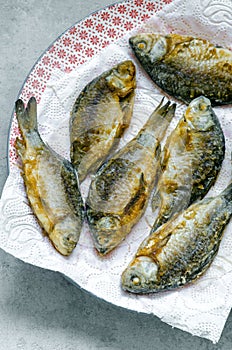 Fried fish on a concrete surface
