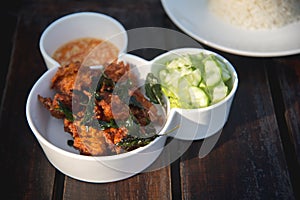 Fried fish and cucumber with sauce and rice