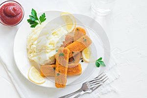 Fried fish fingers, mashed potatoes