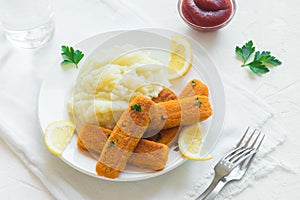 Fried fish fingers, mashed potatoes