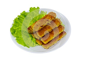 Fried fish fingers on plate with lettuce isolated on white background