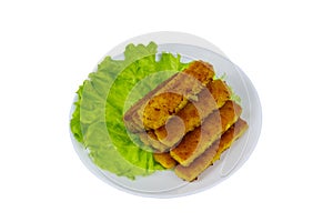 Fried fish fingers on plate with lettuce isolated on white background