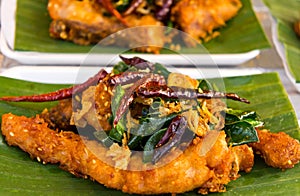 Fried fish with herbs.