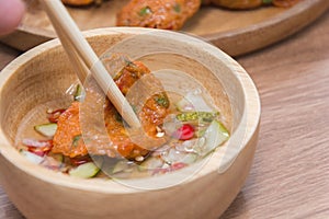 Fried Fish-paste balls with chopsticks