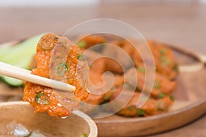 Fried Fish-paste balls with chopsticks