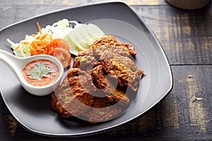 Fried fish patty or Thai Fish cake Tod mun pla on dark background