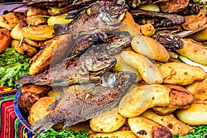 Fried fish & potatoes on streetside stall, Santiago Sacatepequez, Guatemala photo