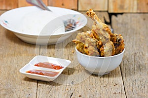 Fried fish sauce marinated chicken drumstick and sauce
