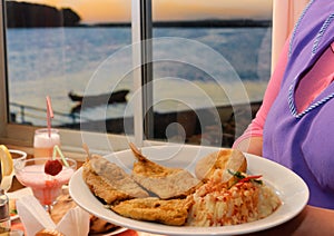 Fried fish served at the table by your cook photo