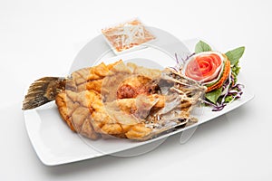 Fried fish served in white dish