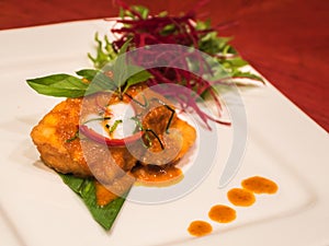 Fried fish with spicy coconut sauce