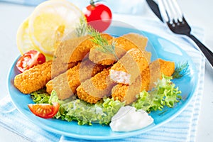 Fried Fish Sticks. Fish Fingers. Fish Sticks with lemon and sauces ready to eat
