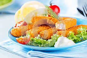 Fried Fish Sticks. Fish Fingers. Fish Sticks with lemon and sauces ready to eat