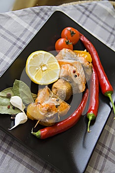 Fried fish with tomatoes and chilli