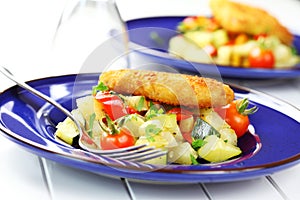 Fried fish on vegetables