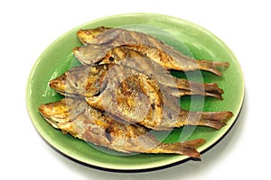 Fried fish on white background. photo