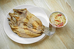 Fried fish on white plate