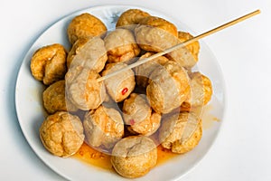 Fried fishballs and sweet sauce.