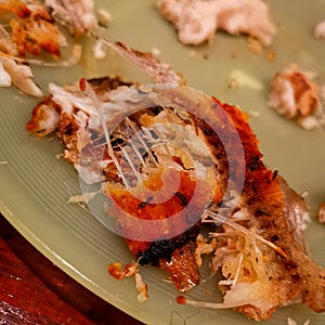 Fried fishh half eaten and made with butter