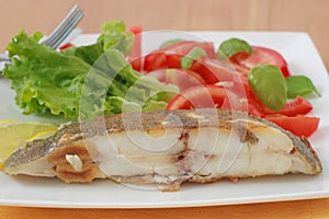 Fried flounder with salad