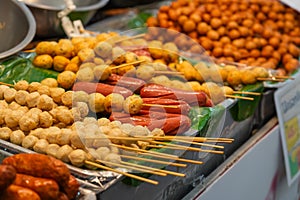 Fried food sausages and meat balls with sticks Thai style food, Thailand street food Bangkok