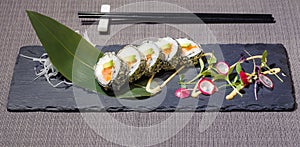 Fried futomaki with rice, avocado, salmon and orange caviar