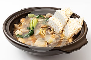 Fried glutinous rice soup with seafood on white background