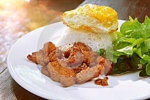 Fried gralic pork served with jasmine rice.