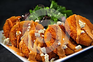 Fried Green Tomatoes covered with Feta Cheese