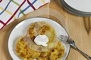 Fried green tomatoes topped with a dollop of sour