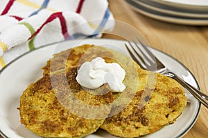 Fried green tomatoes topped with a dollop of sour cream