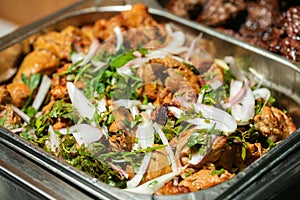 Fried grilled pork chops with caramelized onions