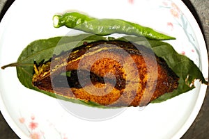 fried Hilsa fish on kitchen