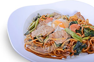 Fried Hokkien Noodles or `Hokkien Mee` with egg on white bowl for Thai food
