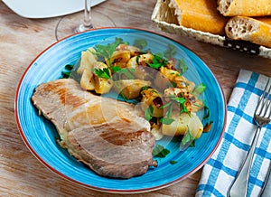 Fried Iberian pig served with potatoes