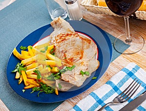 Fried Iberian pig served with potatoes