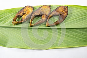 Fried Ilsha or hilsa shad on Turmeric leaf. Tenualosa ilisha.