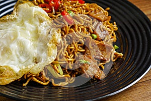 Fried Instant Noodle with fried egg.